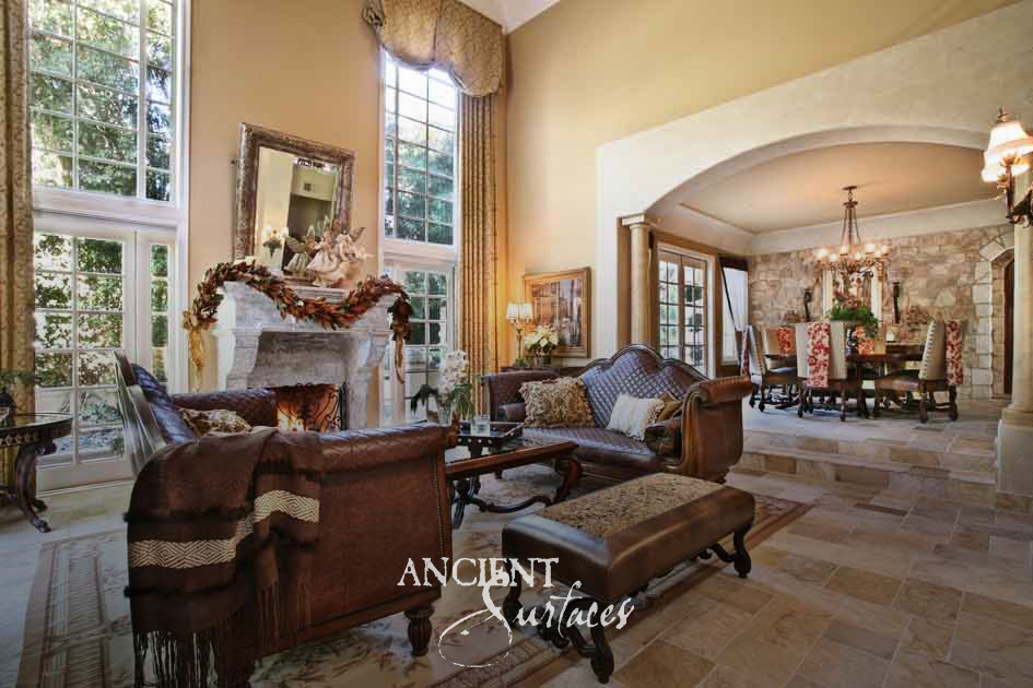 Ancient Surfaces Arcane Limestone floor tiles in sand and taupe tones across a double height living room