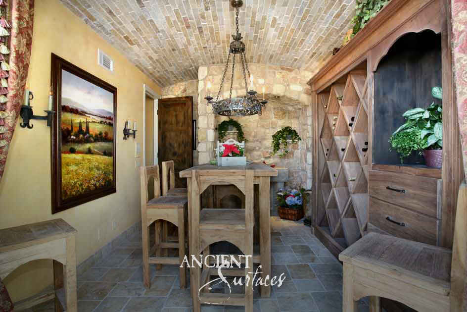 Ancient Surfaces Arcane Stone barrel vault in blush tones above a blue grey stone floor in a wine tasting room