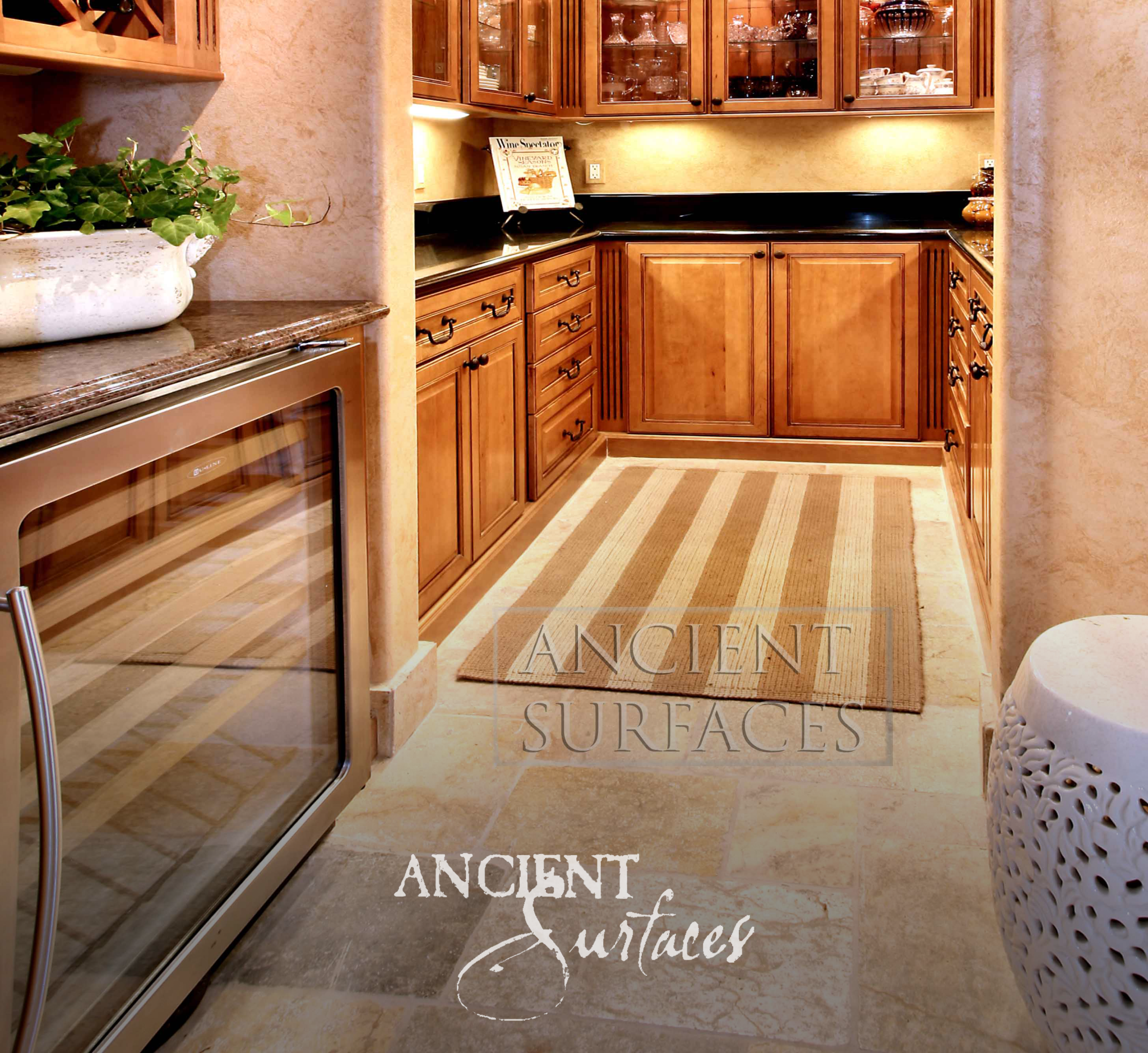 Ancient Surfaces Arcane Limestone honed floor tiles in cream tones through a pantry and wine bar