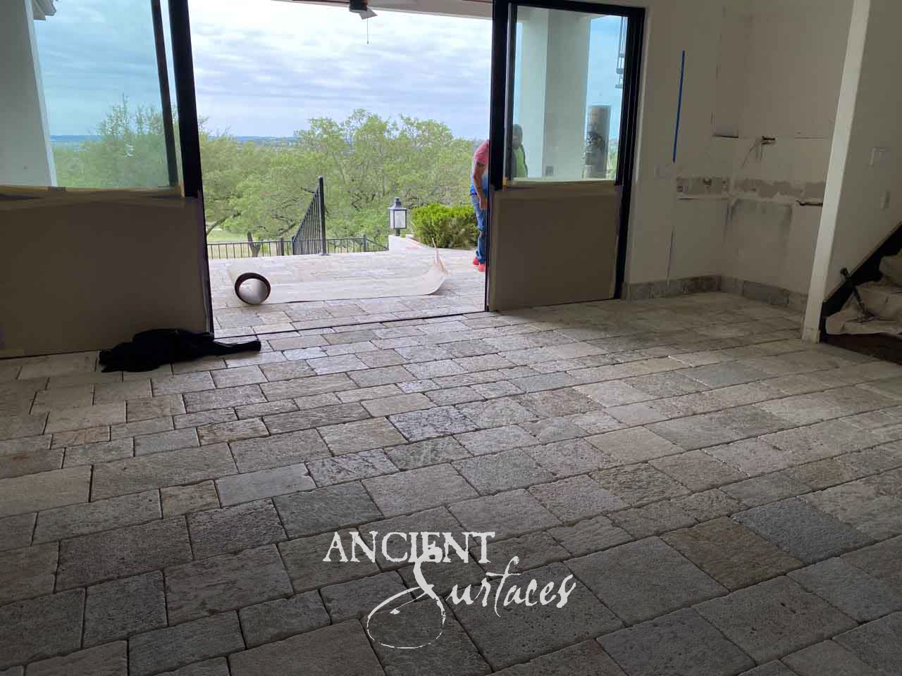 Ancient Surfaces Kronos Limestone small format paving in bleached grey tones running out to a terrace during installation